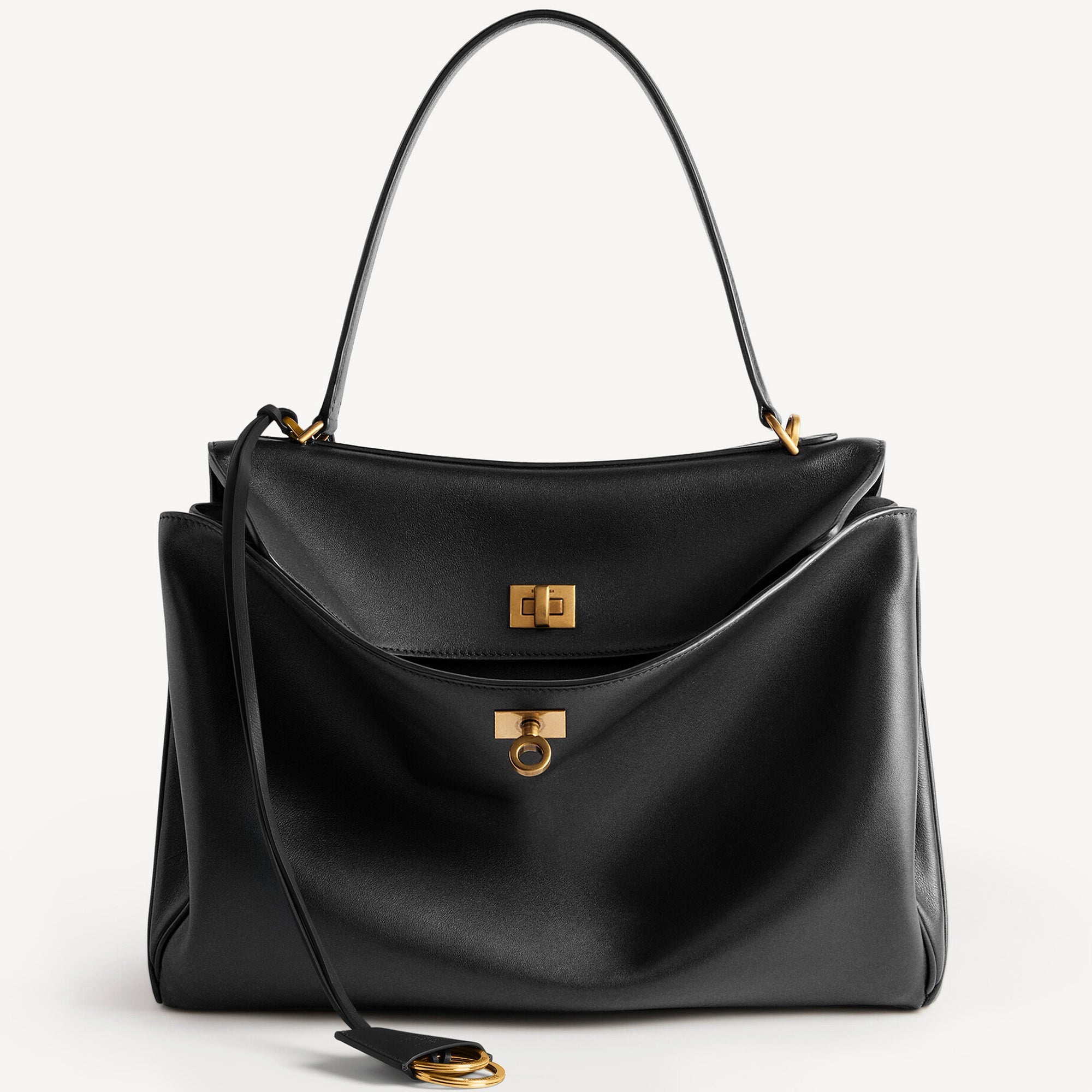 Close-up of Rodeo style slouchy medium tote bag in black with brassy gold hardware