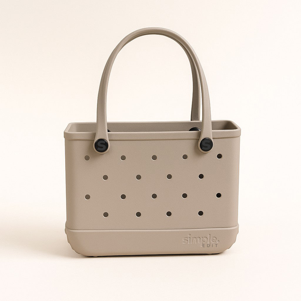 Small EVA Tote in Drift. Pale sandy neutral waterproof tote made from rubber-like EVA. Minimalist and compact for everyday use.