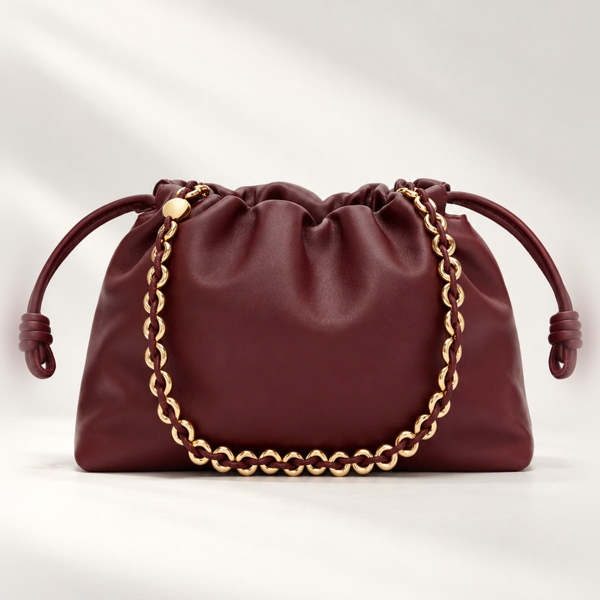 Medium Leather Clutch in Dark Burgundy, soft knot drawstring with gold donut chain and detachable leather strap, 11.8 x 7.9 in
