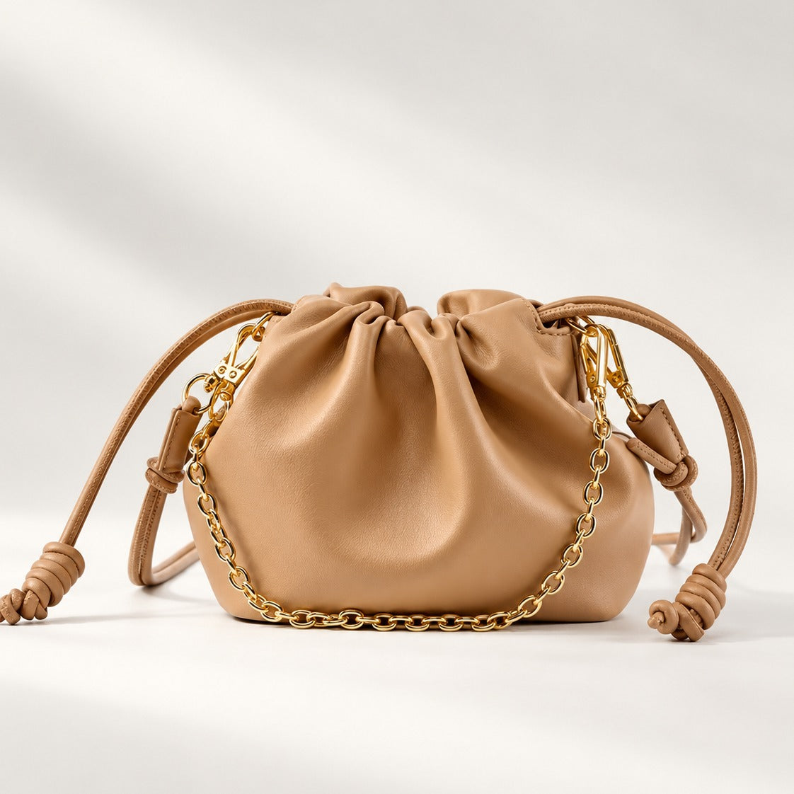 Mini Leather Clutch in Sahara mustard brown, soft knot drawstring with gold chain and detachable strap, 9.1 x 6.7 in