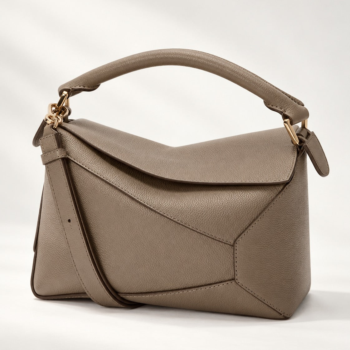 Small Geometric Leather Bag in Taupe, grained leather top handle crossbody with panel stitching and gold hardware