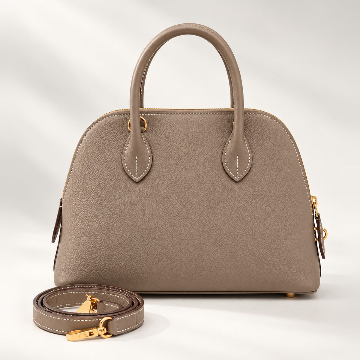 Structured Dome 25 Satchel in Etoupe, vegan leather top handle crossbody bag with gold-tone hardware, 10.2 x 7.9 in
