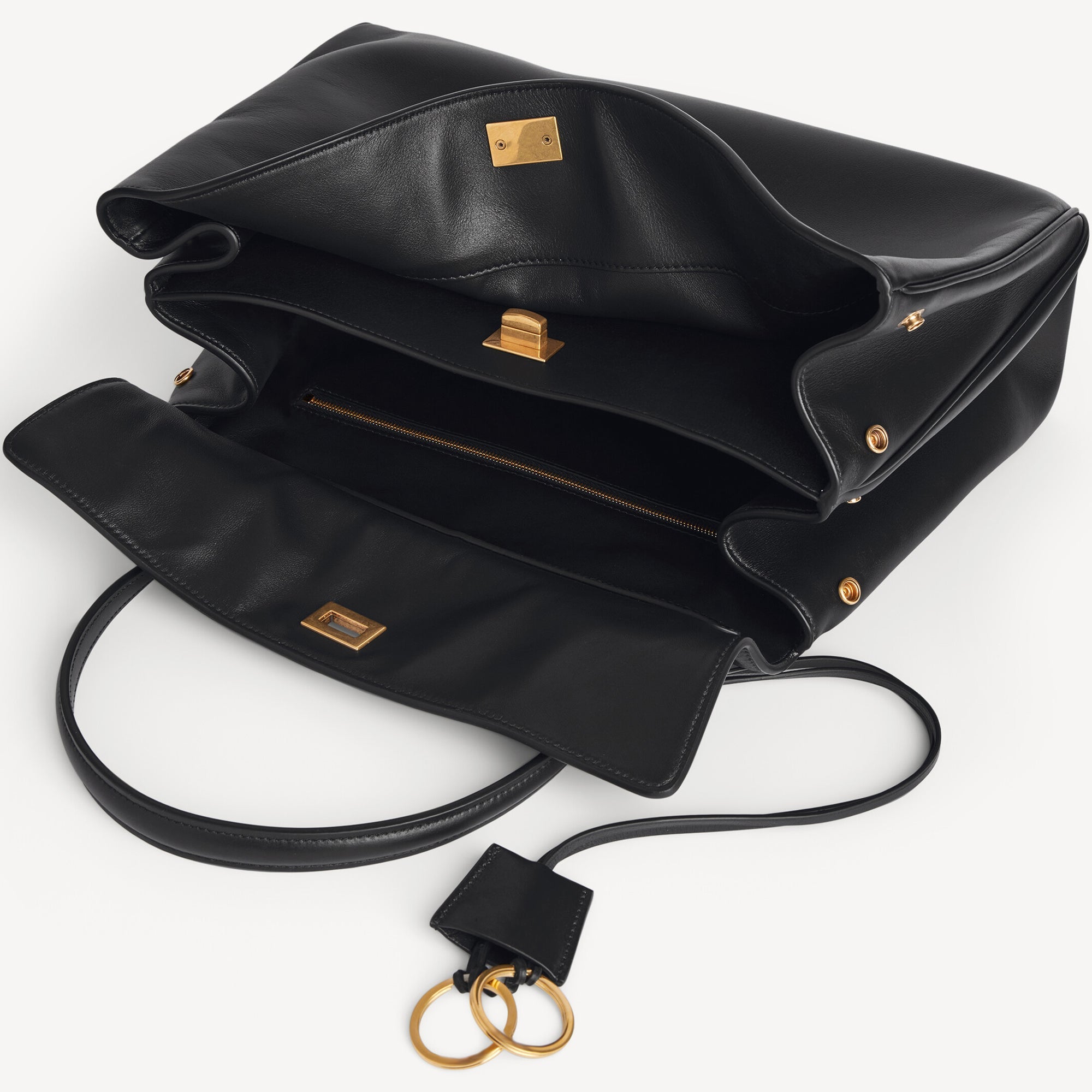 Close-up of Rodeo style slouchy medium tote bag in black with brassy gold hardware