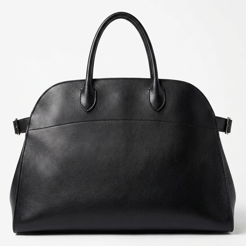 Black leather tote bag with toggle closure and side tabs, silver hardware