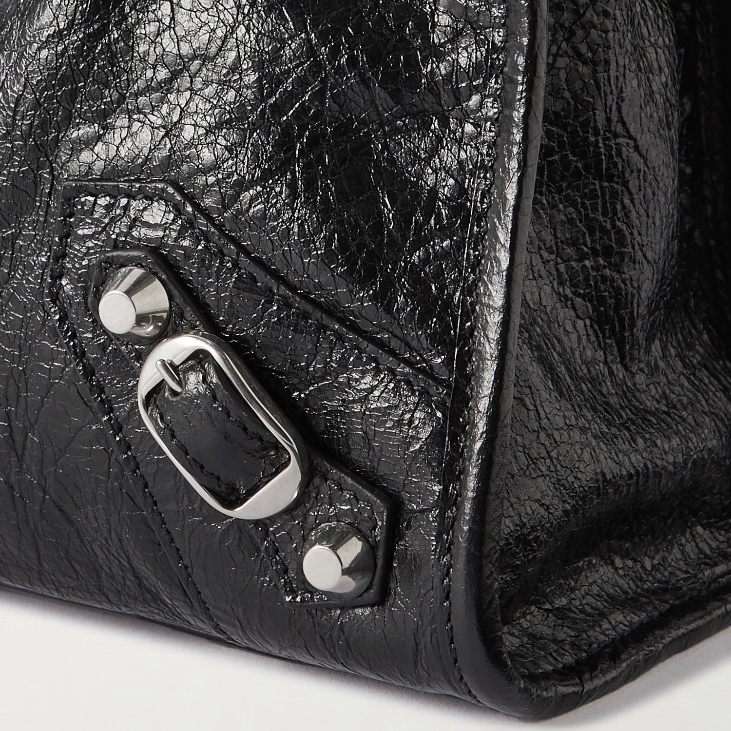 Close-Up of Rolled Leather Handles and Tassel Zipper