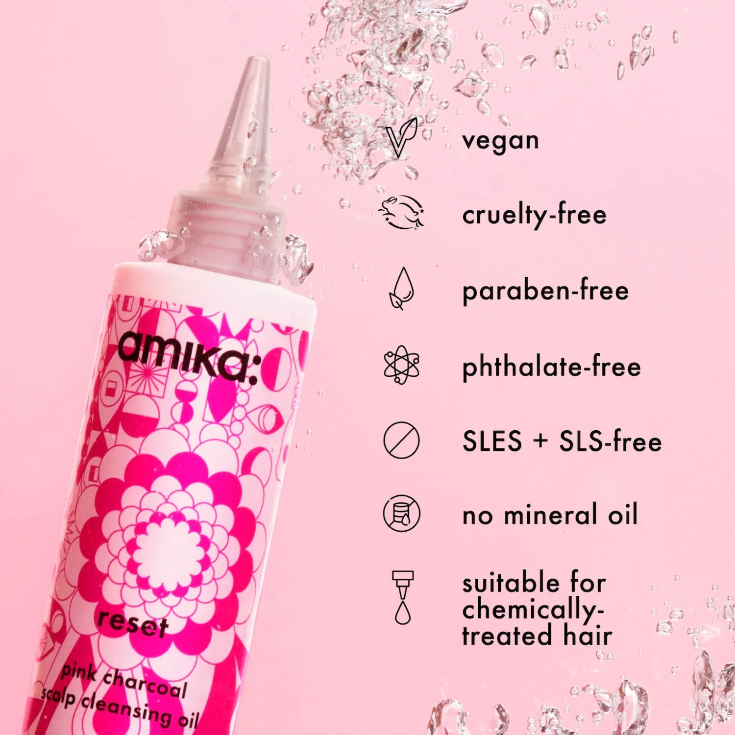 Amika Reset scalp cleansing oil in pink charcoal, shown in a squeeze bottle on a pink background with text highlighting product benefits like vegan, cruelty-free, and paraben-free.