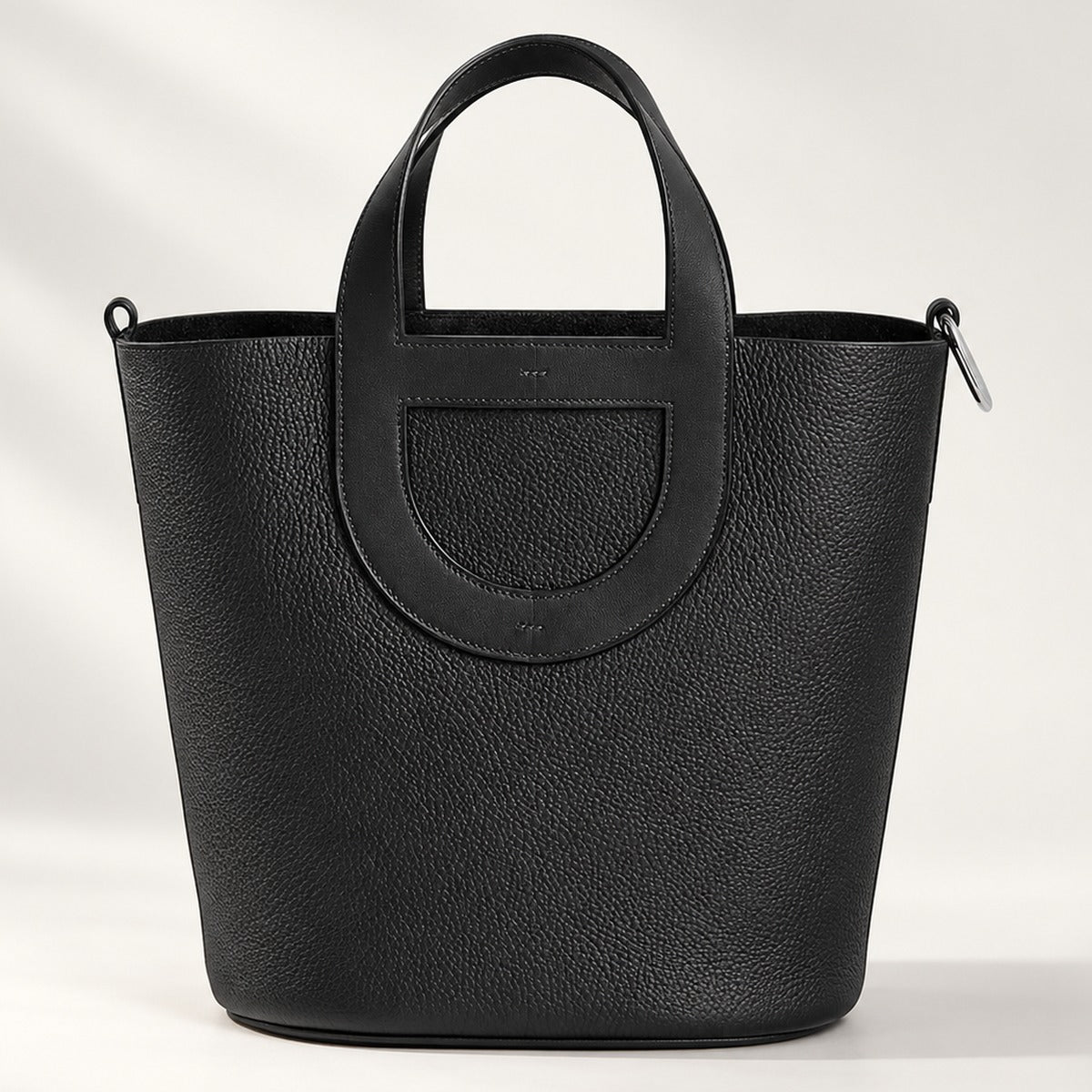 Loop Handle Leather Tote in Black, sculpted leather tote with silver-tone hardware and drawstring pouch, 9.1 x 9.8 in
