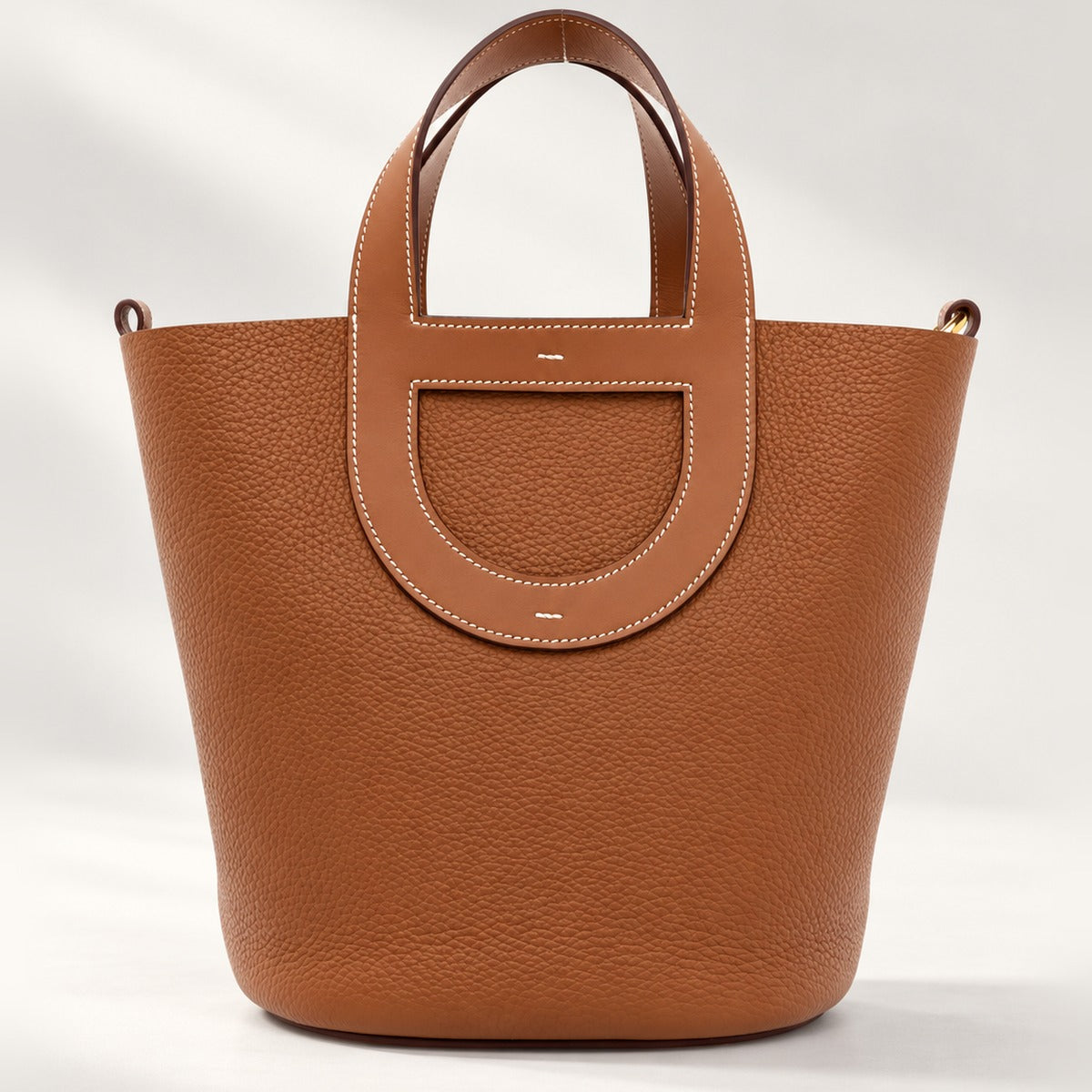Loop Handle Leather Tote in Brown, sculpted leather tote with silver-tone hardware and drawstring pouch, 9.1 x 9.8 in