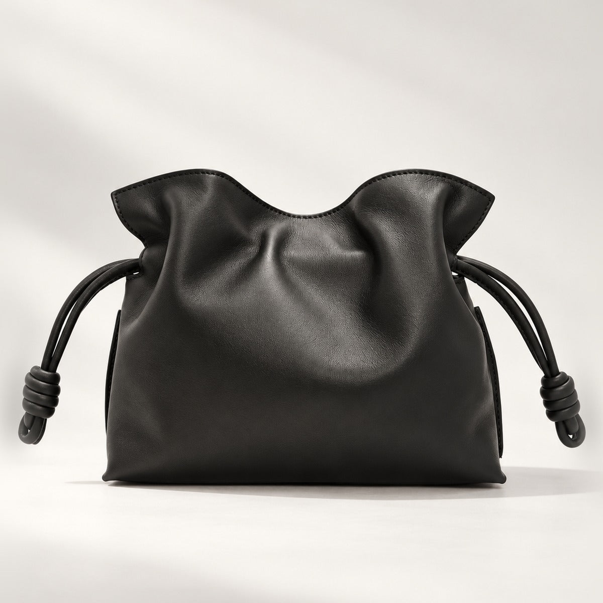 Medium Slouchy Leather Clutch in Black, nappa calf leather with knot drawstring and detachable strap, 11.8 x 9.6 in